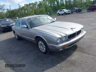 2000 Jaguar XJ with VIN SAJDA14C4YLF13470, listed as a IAAI auction lot 42136313 with 237,063 mi miles and . Bid and sale history available at DreamBid. Image 1.