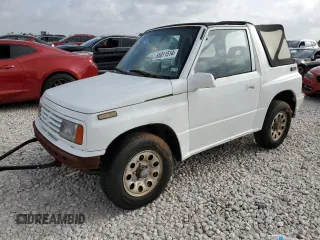 1994 Suzuki Sidekick z VIN 2S3TA01C8R6408593, wystawiony jako Copart lot #65011514 z przebiegiem 248 814 mil mil oraz Tytuł czysty. Historia ofert i sprzedaży dostępna na DreamBid. Obrazek 1.