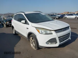 2016 Ford Escape SE z VIN 1FMCU0GXXGUC13444, wystawiony jako IAAI lot #39566364 z przebiegiem 162 059 mil mil oraz . Historia ofert i sprzedaży dostępna na DreamBid. Obrazek 1.
