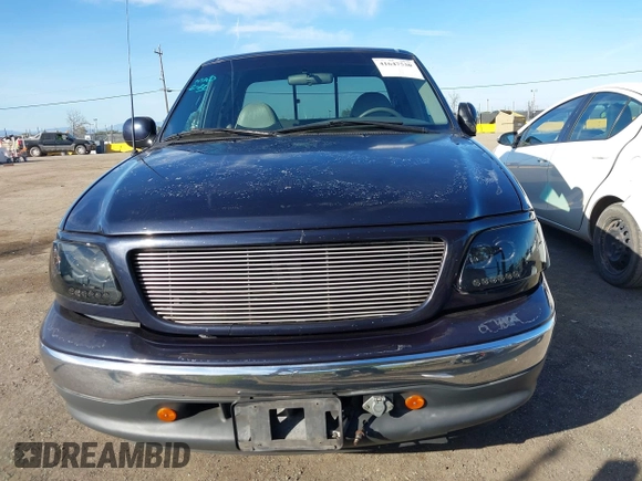 1999 Ford F-150 XL with VIN 1FTRX17L4XKA58054, listed as a IAAI auction lot 41647530 with 225,632 mi miles. Bid and sale history available at carsss.com. Image 12.