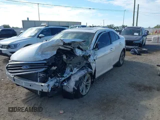 2015 Ford Taurus SEL z VIN 1FAHP2E81FG105404, wystawiony jako IAAI lot #40888773 z przebiegiem Nie podano mil oraz . Historia ofert i sprzedaży dostępna na DreamBid. Obrazek 2.