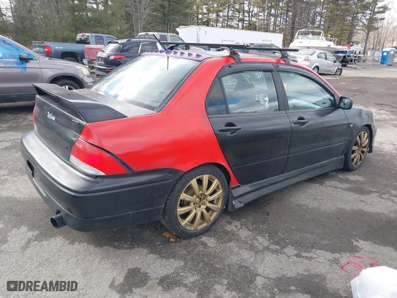 2003 Mitsubishi Lancer OZ-Rally with VIN JA3AJ86E03U078826, listed as a IAAI auction lot 41700333 with 119,656 mi miles. Bid and sale history available at carsss.com. Image 4.