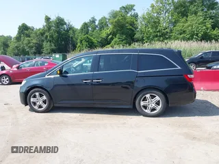 2011 Honda Odyssey Touring with VIN 5FNRL5H97BB073708, listed as a IAAI auction lot 42409164 with 141,986 mi miles and . Bid and sale history available at DreamBid. Image 14.