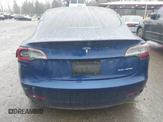 2022 Tesla Model 3 Long Range with VIN 5YJ3E1EB1NF142574, listed as a IAAI auction lot 41213900 with 127,404 mi miles and . Bid and sale history available at DreamBid. Image 16.