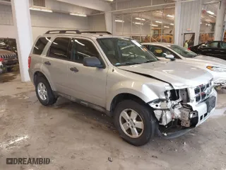 2010 Ford Escape XLT with VIN 1FMCU0D70AKB09942, listed as a IAAI auction lot 41572582 with 218,296 mi miles. Bid and sale history available at carsss.com. Image 1.