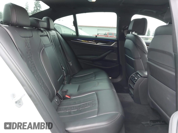 2019 BMW 5 Series 530e with VIN WBAJA9C57KB389401, listed as a IAAI auction lot 42565098 with 52,343 mi miles and . Bid and sale history available at DreamBid. Image 8.