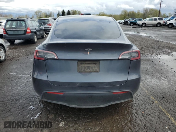 2023 Tesla Model Y Long Range z VIN 7SAYGDEE1PF937867, wystawiony jako Copart lot #51615195 z przebiegiem 88 912 mil mil oraz Szkoda całkowita • Salvage title. Historia ofert i sprzedaży dostępna na DreamBid. Obrazek 6.