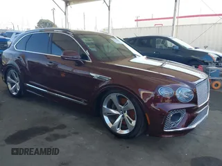 2021 Bentley Bentayga V8 z VIN SJAAM2ZV1MC037602, wystawiony jako IAAI lot #42397866 z przebiegiem Nie podano mil oraz . Historia ofert i sprzedaży dostępna na DreamBid. Obrazek 1.