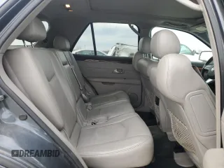 2009 Cadillac SRX RWD z VIN 1GYEE637990137951, wystawiony jako Copart lot #47473825 z przebiegiem 188 592 mil mil oraz Czysty tytuł • Clean title. Historia ofert i sprzedaży dostępna na DreamBid. Obrazek 11.