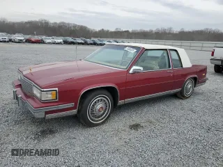 1987 Cadillac DeVille z VIN 1G6CD1181H4318101, wystawiony jako Copart lot #75354324 z przebiegiem Nie podano mil oraz Szkoda całkowita • Salvage title. Historia ofert i sprzedaży dostępna na DreamBid. Obrazek 1.