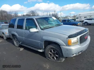 1999 GMC Denali with VIN 1GKEK13R7XR903255, listed as a IAAI auction lot 41496032 with 233,645 mi miles. Bid and sale history available at carsss.com. Image 1.