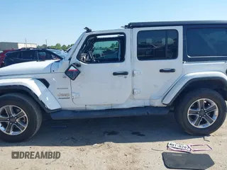 2019 Jeep Wrangler Unlimited Sahara with VIN 1C4HJXEG0KW577917, listed as a IAAI auction lot 41993670 with 90,584 mi miles and . Bid and sale history available at DreamBid. Image 14.