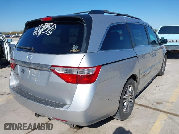 2012 Honda Odyssey EX with VIN 5FNRL5H48CB131881, listed as a IAAI auction lot 41822159 with 354,718 mi miles and . Bid and sale history available at DreamBid. Image 4.
