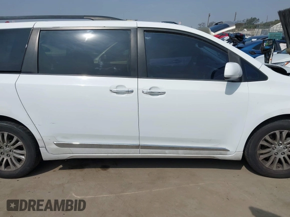 2014 Toyota Sienna XLE z VIN 5TDYK3DC7ES461445, wystawiony jako IAAI lot #42003360 z przebiegiem 153 404 mil mil oraz . Historia ofert i sprzedaży dostępna na DreamBid. Obrazek 14.