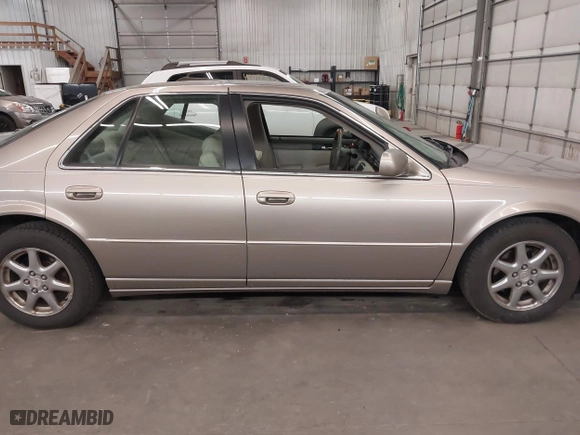 2004 Cadillac Seville Luxury SLS with VIN 1G6KS54Y74U163861, listed as a IAAI auction lot 41881291 with 215,518 mi miles. Bid and sale history available at carsss.com. Image 14.