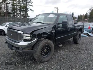 1999 Ford Super Duty F-250 XL with VIN 1FTNX21F2XEC99584, listed as a IAAI auction lot 41611098 with 424,263 mi miles. Bid and sale history available at carsss.com. Image 2.