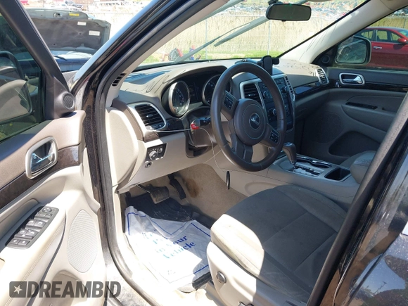 2011 Jeep Grand Cherokee Laredo with VIN 1J4RR4GGXBC546727, listed as a IAAI auction lot 42232520 with 268,616 mi miles and . Bid and sale history available at DreamBid. Image 13.