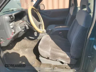 1997 GMC Sonoma SLS with VIN 1GTCS19X2V8528113, listed as a Copart auction lot 48530915 with 214,072 mi miles and Salvage Title. Bid and sale history available at DreamBid. Image 7.