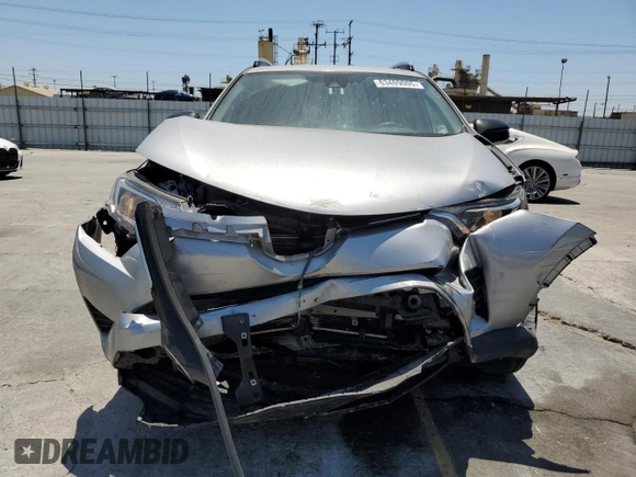 2017 Toyota RAV4 LE with VIN 2T3BFREV6HW658235, listed as a Copart auction lot 63409005 with 62,303 mi miles and Salvage title. Bid and sale history available at DreamBid. Image 5.