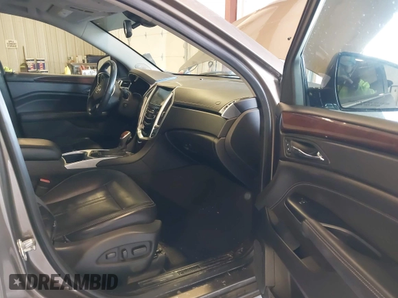 2015 Cadillac SRX Luxury Collection with VIN 3GYFNBE34FS575613, listed as a IAAI auction lot 41697251 with 173,117 mi miles and . Bid and sale history available at DreamBid. Image 5.