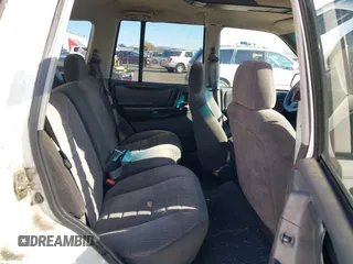 1996 Jeep Grand Cherokee Laredo z VIN 1J4GZ58Y5TC186403, wystawiony jako IAAI lot #41562270 z przebiegiem 205 797 mil mil oraz . Historia ofert i sprzedaży dostępna na DreamBid. Obrazek 8.
