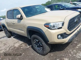 2018 Toyota Tacoma SR with VIN 5TFCZ5ANXJX161717, listed as a IAAI auction lot 42230932 with 56,441 mi miles and . Bid and sale history available at DreamBid. Image 1.