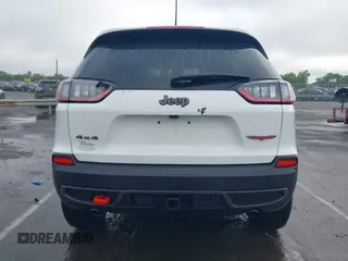 2022 Jeep Cherokee Trailhawk z VIN 1C4PJMBX1ND500729, wystawiony jako IAAI lot #42235098 z przebiegiem 60 354 mil mil oraz . Historia ofert i sprzedaży dostępna na DreamBid. Obrazek 16.