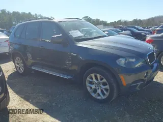 2011 BMW X5 35i with VIN 5UXZV4C51BL740731, listed as a IAAI auction lot 41771257 with 148,638 mi miles. Bid and sale history available at carsss.com. Image 1.