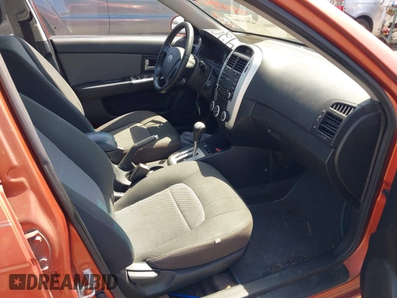 2009 Kia Spectra EX with VIN KNAFE221195026956, listed as a IAAI auction lot 42019309 with 121,341 mi miles. Bid and sale history available at carsss.com. Image 5.