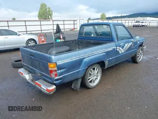 1988 Toyota Pickup with VIN JT4RN50R5J5169942, listed as a IAAI auction lot 42152517 with 218,579 mi miles and . Bid and sale history available at DreamBid. Image 4.