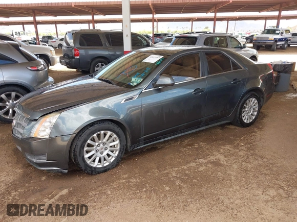 2011 Cadillac CTS Luxury with VIN 1G6DF5EY6B0104932, listed as a IAAI auction lot 42032457 with 165,833 mi miles and . Bid and sale history available at DreamBid. Image 2.
