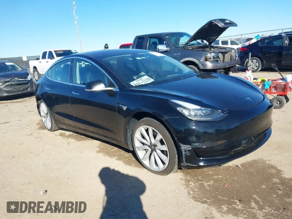 2018 Tesla Model 3 Long Range Battery with VIN 5YJ3E1EA2JF014975, listed as a IAAI auction lot 41319407 with 106,301 mi miles and . Bid and sale history available at DreamBid. Image 1.