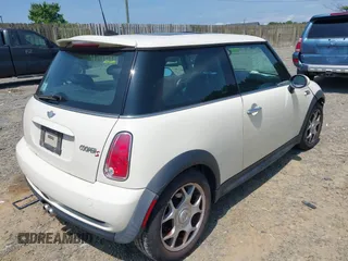2006 MINI Hardtop S with VIN WMWRE33596TJ37959, listed as a IAAI auction lot 42635457 with 124,440 mi miles and . Bid and sale history available at DreamBid. Image 4.