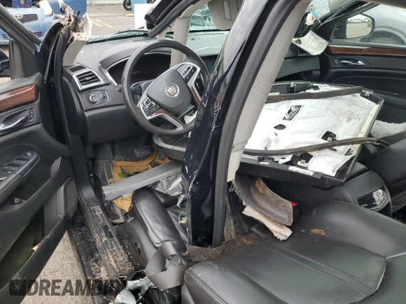 2014 Cadillac SRX Premium Collection z VIN 3GYFNGE31ES688270, wystawiony jako Copart lot #52795245 z przebiegiem 134 103 mil mil oraz Szkoda całkowita • Salvage title. Historia ofert i sprzedaży dostępna na DreamBid. Obrazek 8.