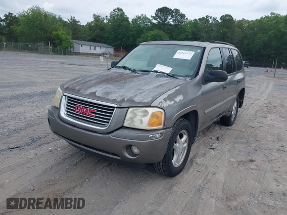 2007 GMC Envoy SLE with VIN 1GKDS13S572174308, listed as a IAAI auction lot 42211372 with 212,377 mi miles and . Bid and sale history available at DreamBid. Image 2.