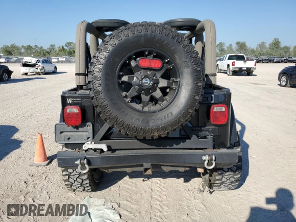 2004 Jeep Wrangler Sahara with VIN 1J4FA59S04P772756, listed as a Copart auction lot 47973495 with 92,685 mi miles and Salvage Title. Bid and sale history available at DreamBid. Image 6.