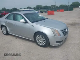 2013 Cadillac CTS Luxury with VIN 1G6DE5E57D0177531, listed as a IAAI auction lot 42424456 with 122,512 mi miles and . Bid and sale history available at DreamBid. Image 1.
