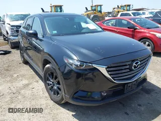 2016 Mazda CX-9 Touring with VIN JM3TCACY7G0101632, listed as a IAAI auction lot 42191115 with 163,070 mi miles and . Bid and sale history available at DreamBid. Image 1.