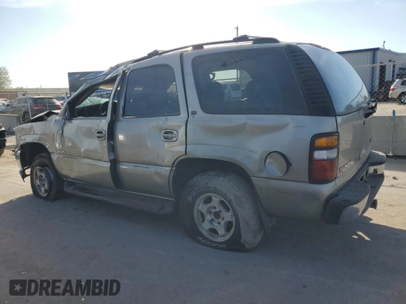 2000 GMC Yukon SLE with VIN 1GKEK13T2YJ130870, listed as a Copart auction lot 82887054 with 310,765 mi miles and Salvage Title. Bid and sale history available at carsss.com. Image 2.