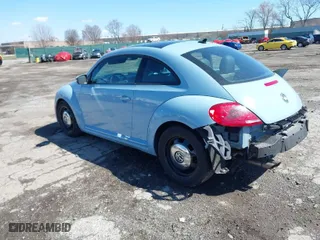 2013 Volkswagen Beetle Coupe 2.5L with VIN 3VWJP7AT5DM687994, listed as a IAAI auction lot 41878063 with 1 mi miles. Bid and sale history available at carsss.com. Image 3.