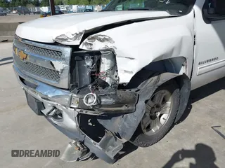 2013 Chevrolet Silverado 1500 LT with VIN 3GCPKSE71DG358722, listed as a IAAI auction lot 42128592 with 206,779 mi miles and . Bid and sale history available at DreamBid. Image 6.