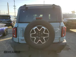 2021 Ford Bronco z VIN 1FMDE5AP0MLA98152, wystawiony jako Copart lot #84872094 z przebiegiem 10 907 mil mil oraz Szkoda całkowita • Salvage title. Historia ofert i sprzedaży dostępna na DreamBid. Obrazek 6.