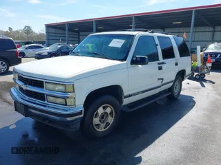 1999 Chevrolet Tahoe Z71 with VIN 1GNEK13R3XJ412067, listed as a IAAI auction lot 41789660 with 196,916 mi miles and . Bid and sale history available at DreamBid. Image 2.