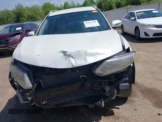 2016 Nissan Rogue SV with VIN KNMAT2MT2GP633600, listed as a IAAI auction lot 39191100 with 128,051 mi miles and . Bid and sale history available at DreamBid. Image 12.