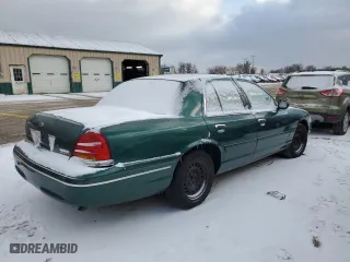 2000 Ford Crown Victoria with VIN 2FAFP73WXYX157746, listed as a Copart auction lot 82748804 with 56,820 mi miles and Salvage Title. Bid and sale history available at carsss.com. Image 3.
