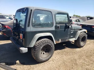 1998 Jeep Wrangler Sport with VIN 1J4FY19S2WP790179, listed as a Copart auction lot 69853294 with 148,675 mi miles and Salvage Title. Bid and sale history available at carsss.com. Image 3.