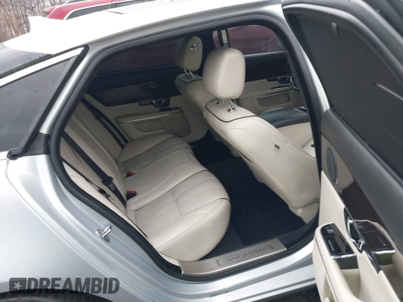 2015 Jaguar XJ with VIN SAJWA2GZ8F8V83551, listed as a IAAI auction lot 41909403 with 112,098 mi miles. Bid and sale history available at carsss.com. Image 8.