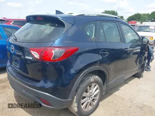 2016 Mazda CX-5 Sport z VIN JM3KE2BY0G0633611, wystawiony jako IAAI lot #42390654 z przebiegiem Nie podano mil oraz . Historia ofert i sprzedaży dostępna na DreamBid. Obrazek 4.