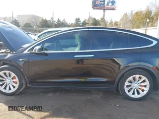 2018 Tesla Model X 75D with VIN 5YJXCDE44JF091690, listed as a IAAI auction lot 41585617 with 128,826 mi miles and . Bid and sale history available at DreamBid. Image 14.