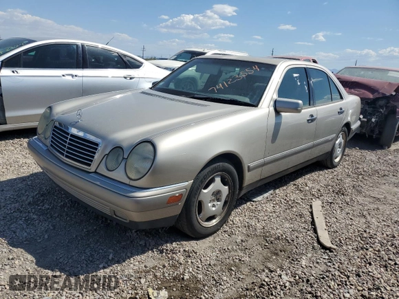 1997 Mercedes-Benz E-Class with VIN WDBJF72F2VA274233, listed as a Copart auction lot 74123554 with 80,914 mi miles and Salvage Title. Bid and sale history available at carsss.com. Image 1.